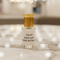 White oud perfume on marble
